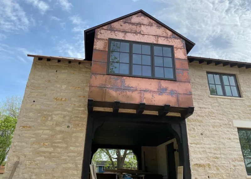 Copper metal panel facade on a stone building for Metal Roof Coating in Kapaa