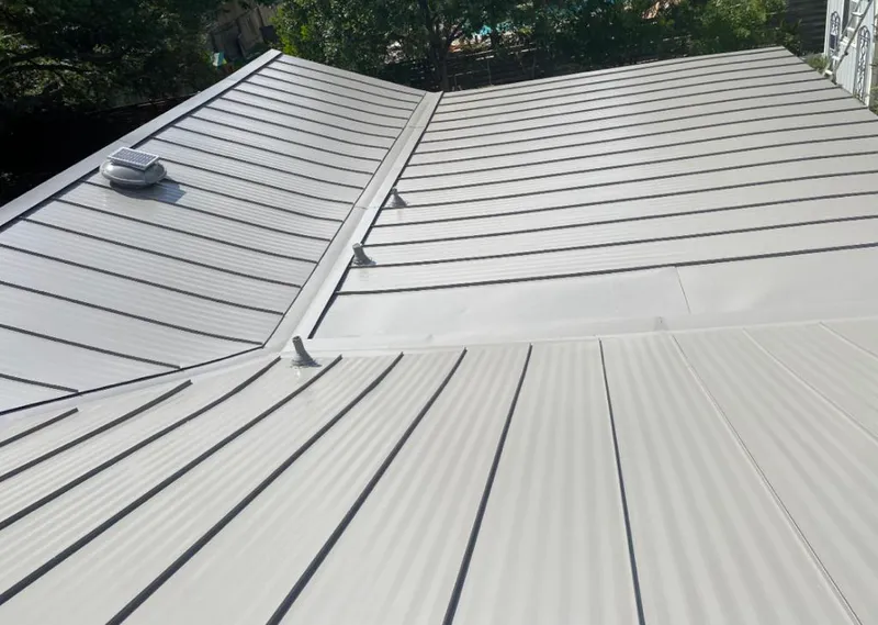 Solar attic fan installed on a metal roof for Roof Ventilation in Kapaa